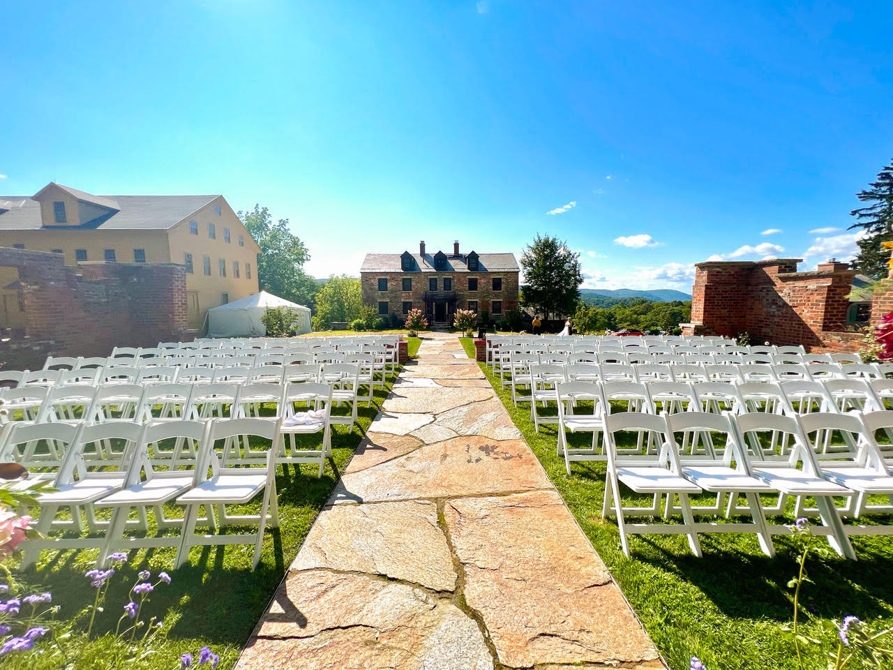 A wedding setup in front of the Stone House