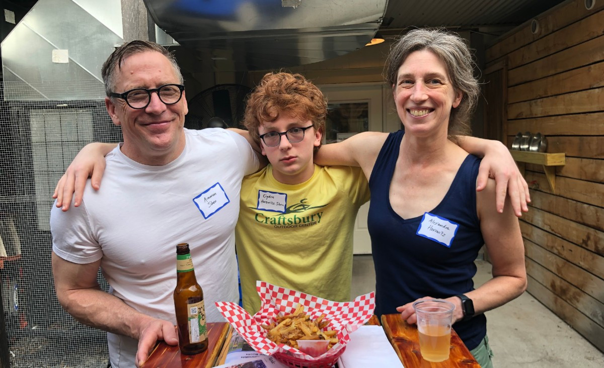 Authors Ammon Shea and Alexandra Horowitz flank Ogden Horowitz-Shea