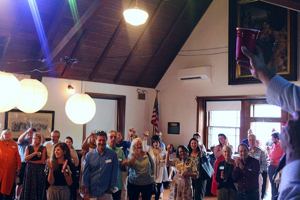 Brian K. Mahoney leads a toast to Rural Intelligence