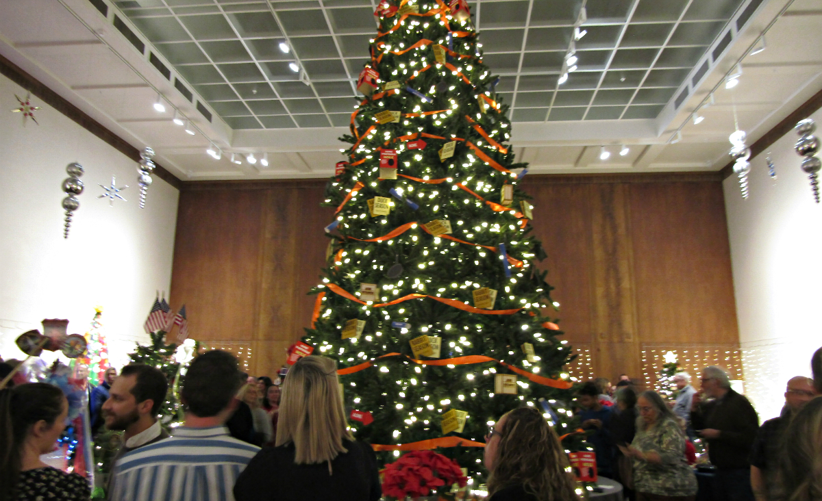 A towering tree holds court in the center of the Museum&#39;s Crane Room.