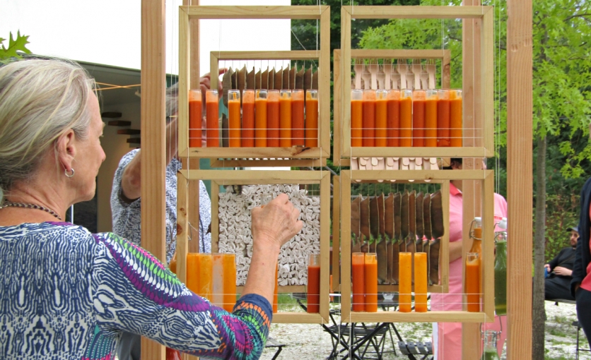 A guest chooses a fresh gazpacho from one of the works of art during TurnPark Art Space's inaugural gala. A guest chooses a fresh gazpacho from one of the works of art during TurnPark Art Space's inaugural gala.
