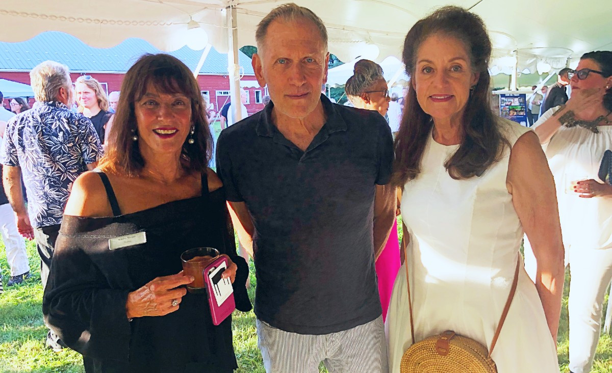Trustees Kathy Weiser and Rae Gilson flank Alan Wanzenberg