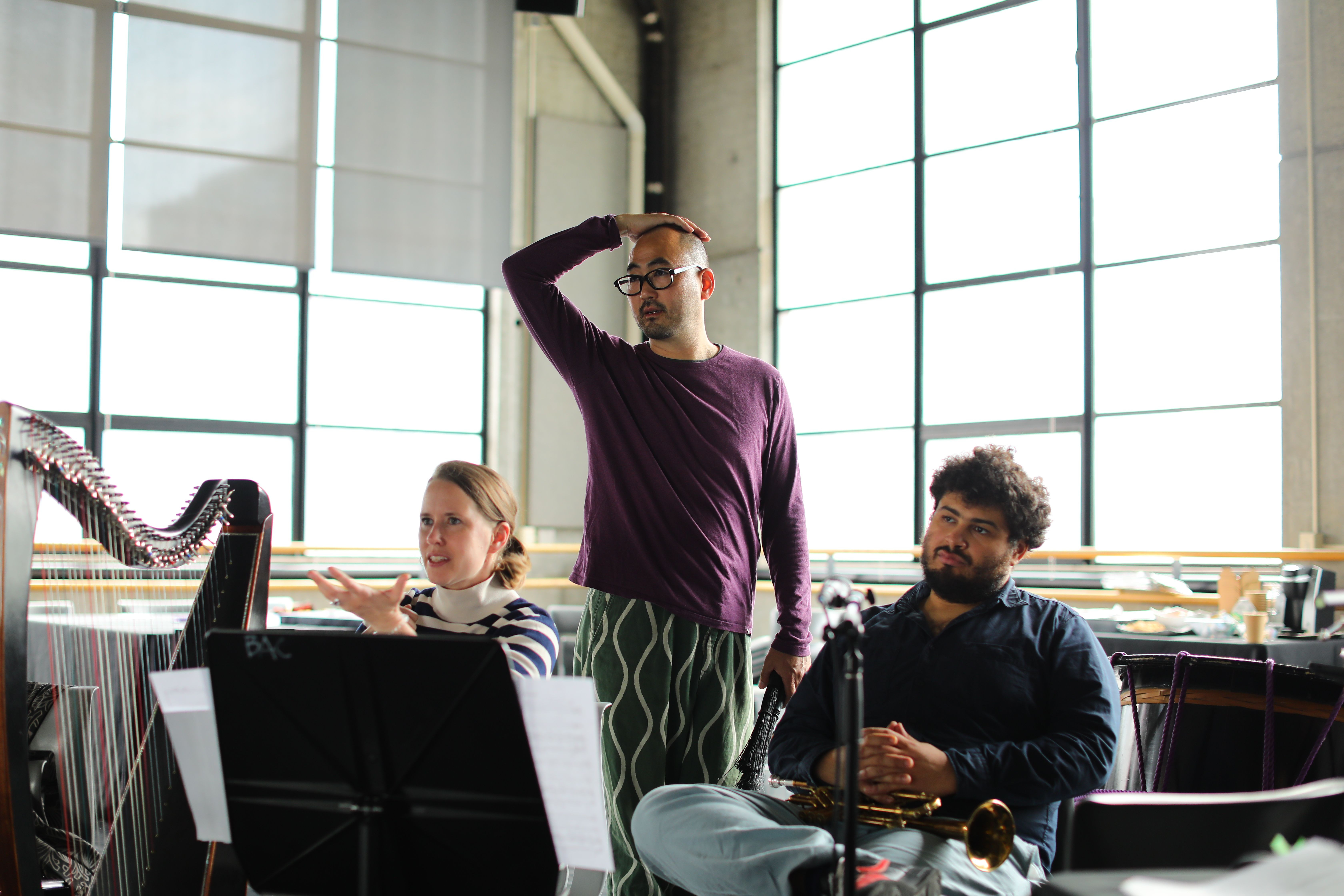 Bloodlines Interwoven Festival Artistic Director Kauro Watanabe, standing, at&nbsp;Baryshnikov Arts in New York City,&nbsp; flanked by musicians Maeve&nbsp;Gilchrist and Adam O&#39;Farrill. All photos provided by Baryshnikov Arts.