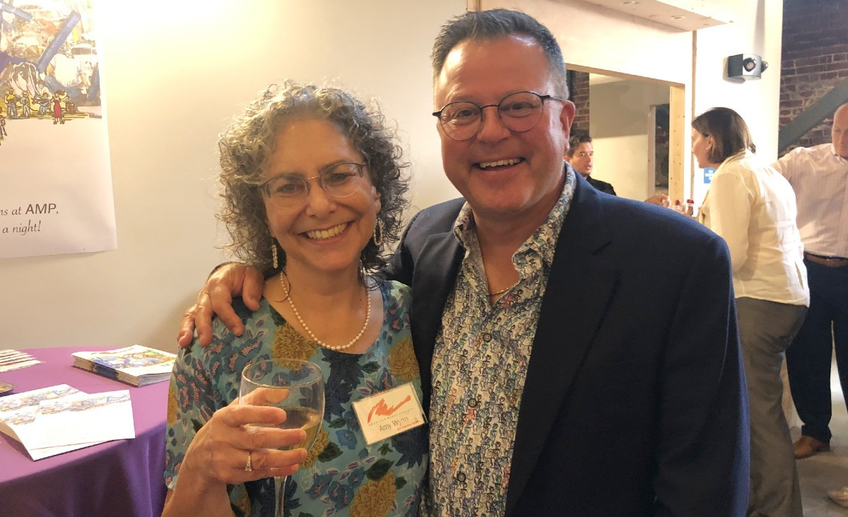Executive director Amy Wynn with Scott Boos, whose company built the armature for the mural