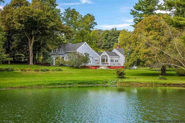 Farmhouse With A Pond
