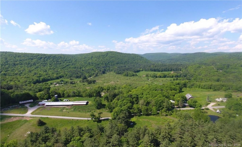 <p>On 88 acres with a main house, barns and out buildings</p>