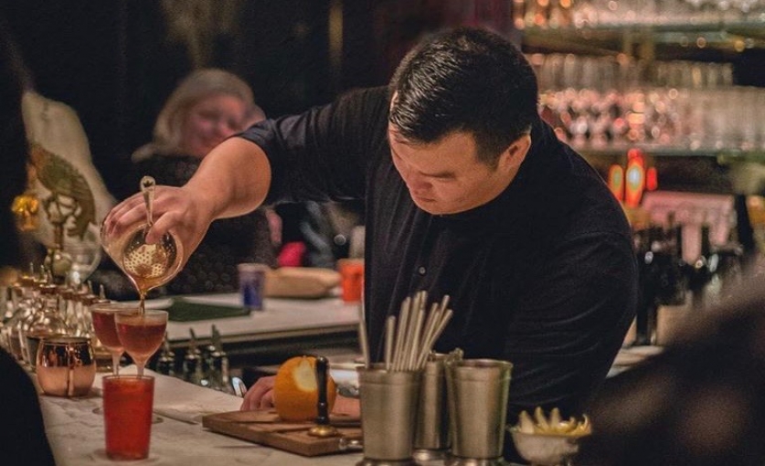 <p><strong>Head Mixologist Michael Kang at work on the new cocktail&nbsp;list.</strong></p>