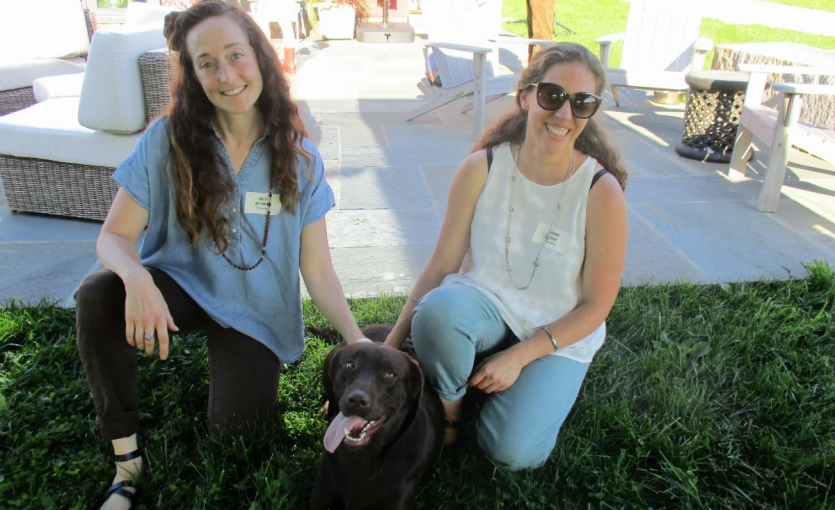 <p><strong>Farmer&rsquo;s Table committee members Nicole Matthews and Lucinda Pittari with Akira, the chocolate Lab that belongs to the Shabets.</strong></p>