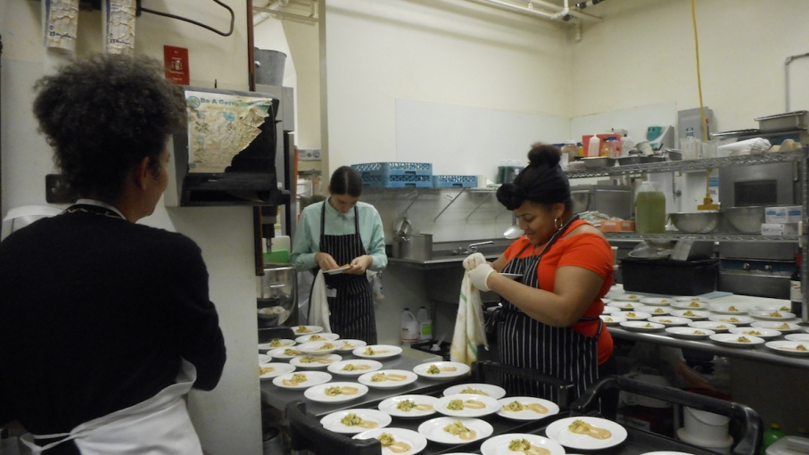 <p><strong>The budding chefs of RSYP prepare the plates for the first course.</strong></p>